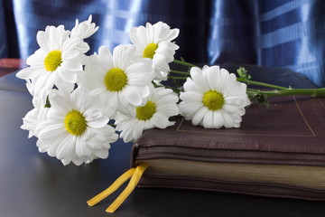 flowers on a Bible in leather bound