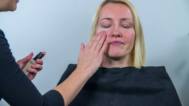 Woman comes to get her make up done 