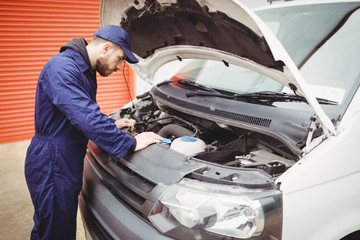 Mechanic fixing a van