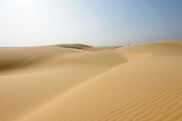 Fototapeta na wymiar White sands Dunes in Vietnam, White desert background,Popular tourist attractions in South of Vietnam.