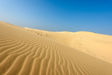 Obraz na płótnie Canvas White sands Dunes in Vietnam, White desert background,Popular tourist attractions in South of Vietnam.