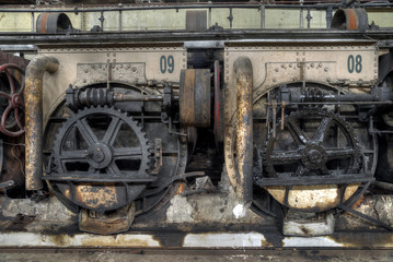 Fototapeta na wymiar Gear wheels in colonial sugar factory in Gondang Baru, Java, Indonesia