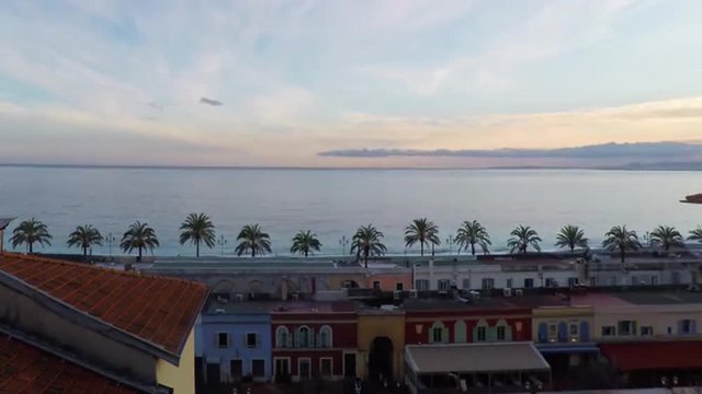 Time lapse of panoramic view of coastline and beach with old market in Nice, Cote d'Azur, French Riviera.