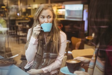Woman drinking a cup of coffee