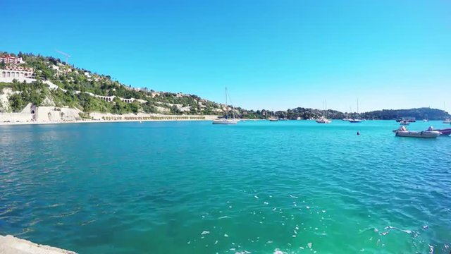 Panoramic view of coastline and beach with blue sky, Villefranche-sur-Mer, Nice, Cote d'Azur, French Riviera.