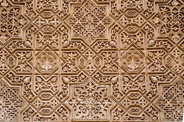 Wall detail with arab ornament in Alhambra, Granada, Spain. - obrazy, fototapety, plakaty