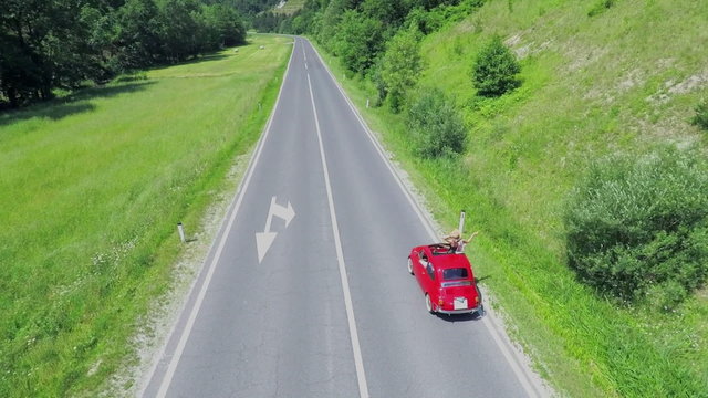 Driving in a red vintage zastava car