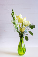 Orchid,tulip,hyacinth flower composition in glass vases.