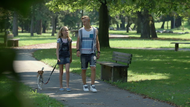 Two Teenager Is Walking Through Park