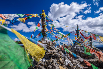tibetan prayer flags over mountains