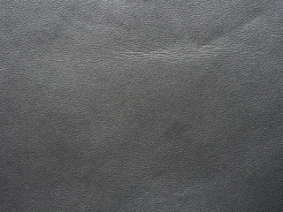 Surface of dark genuine leather background