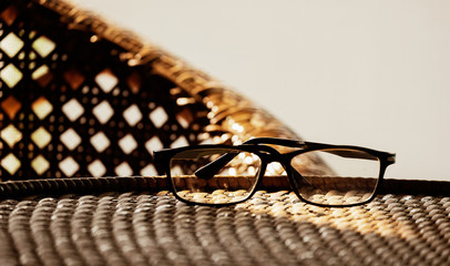 glasses on top of rattan furniture, in modern house with vintage