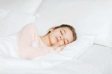 girl sleeping in bed at home