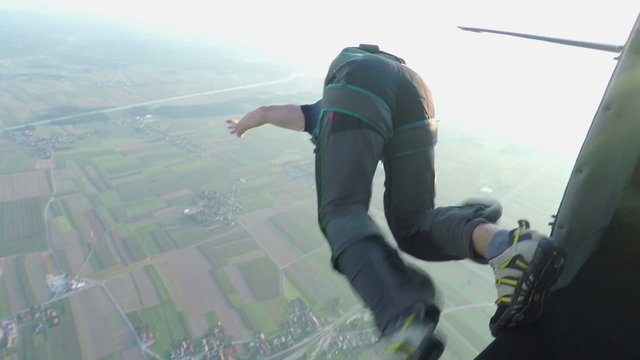 Guy jumping off a plane