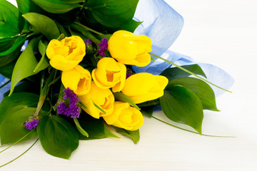 Bouquet of yellow tulips in a gift, place for text, selective fo