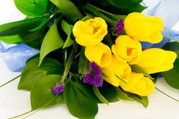 Bouquet of yellow tulips in a gift, place for text, selective fo