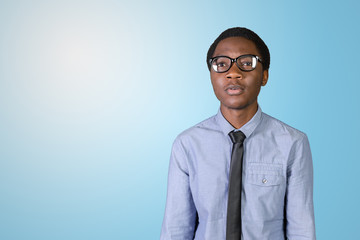 Portrait of happy young african guy with his arms crossed