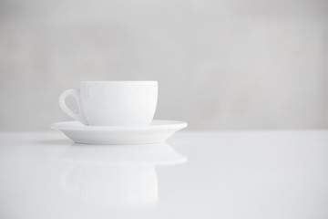 cup on white table