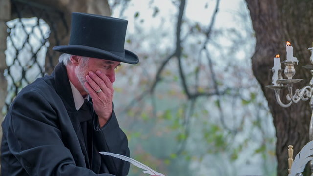 Composer taking a pause while writing a poem 