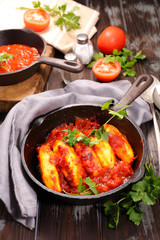 quenelle with tomato sauce