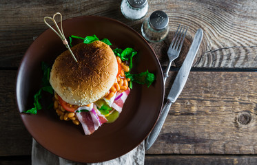 Burger with bacon beans and poached egg