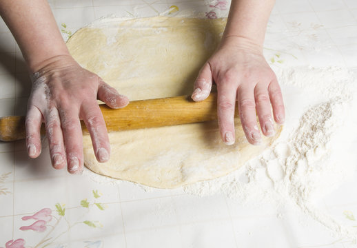 Making dough by female hands