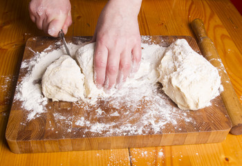 Making dough by female hands