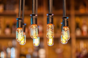 Glowing tungsten lamp in a pub
