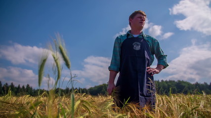 Farmer in the middle of wheat field