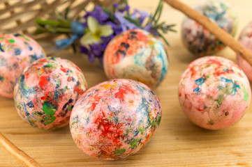 Painted Easter eggs falling out of basket