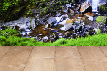 Wood table near waterfall