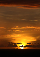 TROPICAL SUNSET OVER SEA