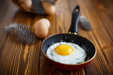 fried eggs in a frying pan