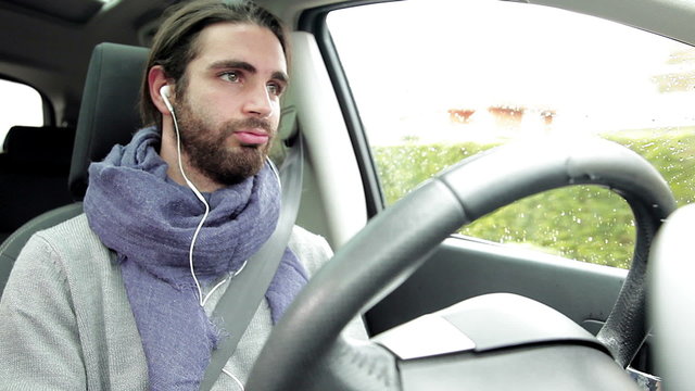 Man getting bored about phone conversation feeling disappointed while driving car