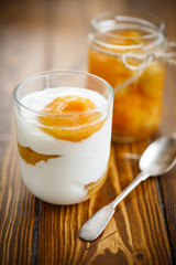 Greek yogurt with canned apricots in a glass 