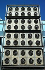 Industrial air conditioning. Commercial cooling HVAC fans on outside of building. 