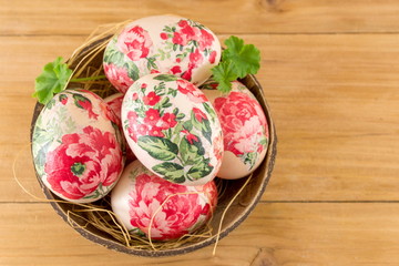 Decorated Easter eggs in a coconut shell