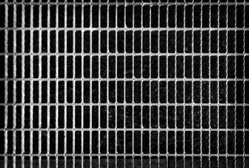 Metal grid background.Metal grill pattern texture. Black and white image.