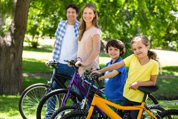 Smiling family with their bikes