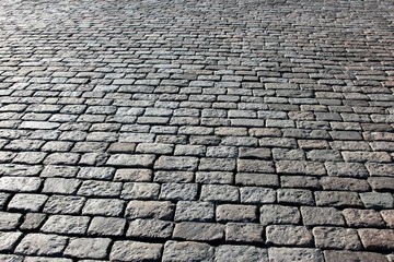 pavement made of stone in sunlight and backlit conditions