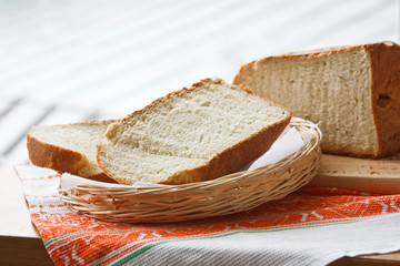 Homemade sliced bread in a wicker basket.