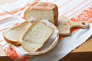Homemade sliced bread in a wicker basket.