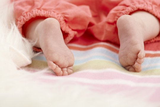 Closeup bare baby feet