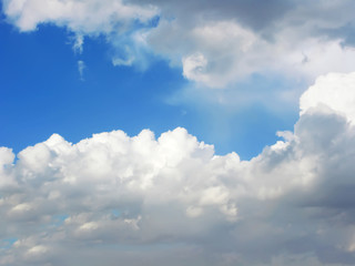 Fototapeta na wymiar Blue sky with fluffy white clouds in day light