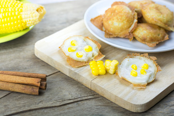 Kanom Krok on wooden table. Kind of Thai sweetmeat , thai desser