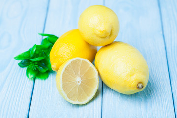 Fresh lemon on a blue wooden background