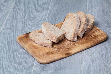 Closeup of sliced bread on a chopping board