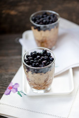 Fototapeta na wymiar Chia seeds pudding with blueberries in a glass