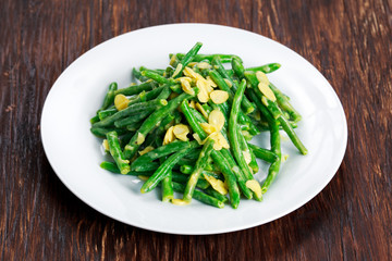 Green beans roasts garlic and flaked almond