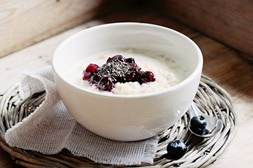 Oatmeal porridge with blueberry jam and chia seeds.Superfoods concept.